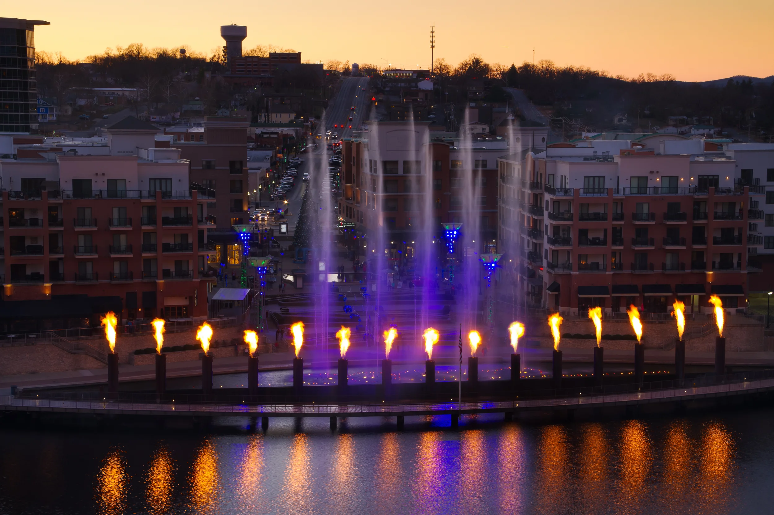 water fountain show by river at night